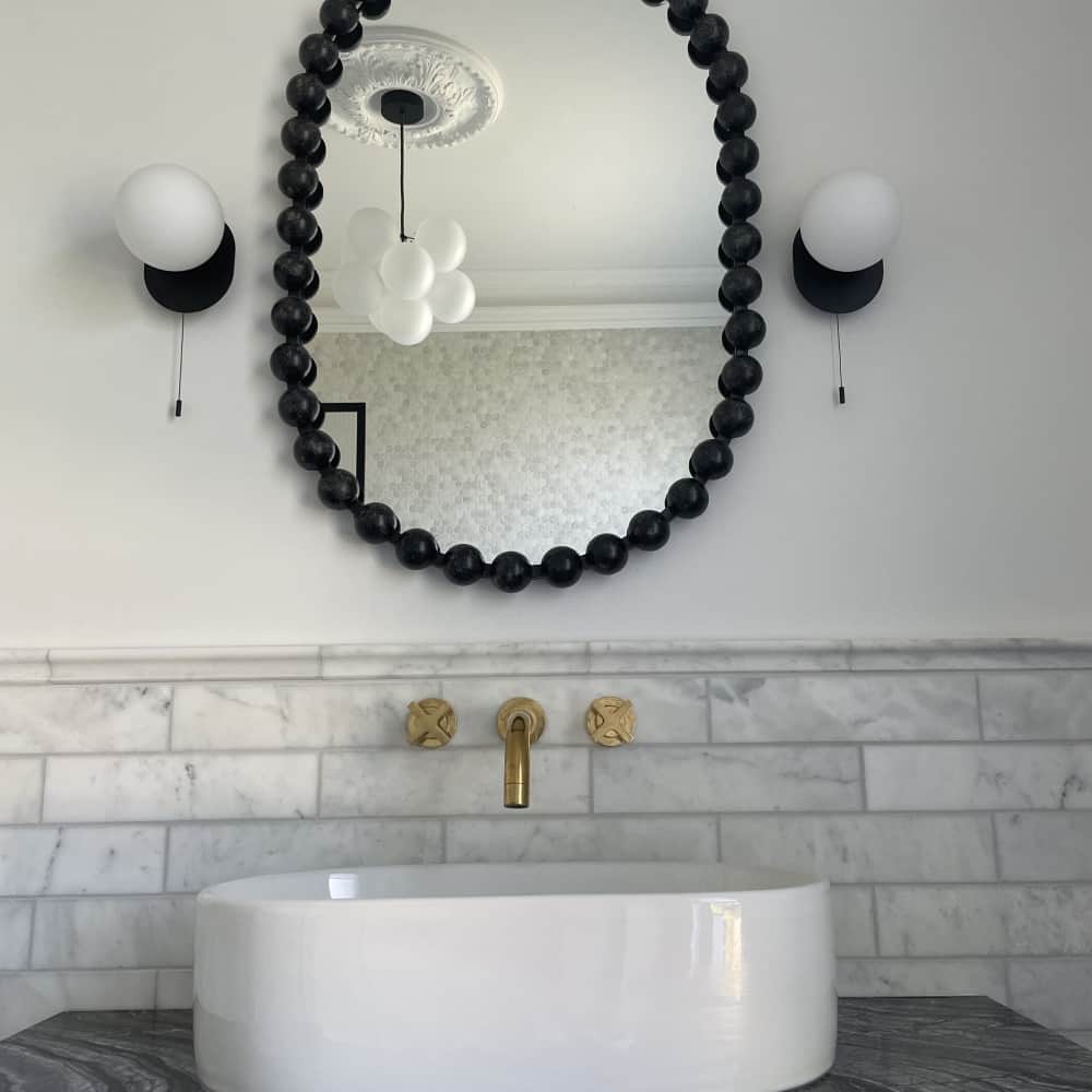 Modern wash area design with mirror and lamp by Jikka - Bromley Bathroom Company