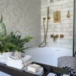 Inside look of the bathroom showcasing the bathtub and other accessories by Jikka - Bathroom Bromley