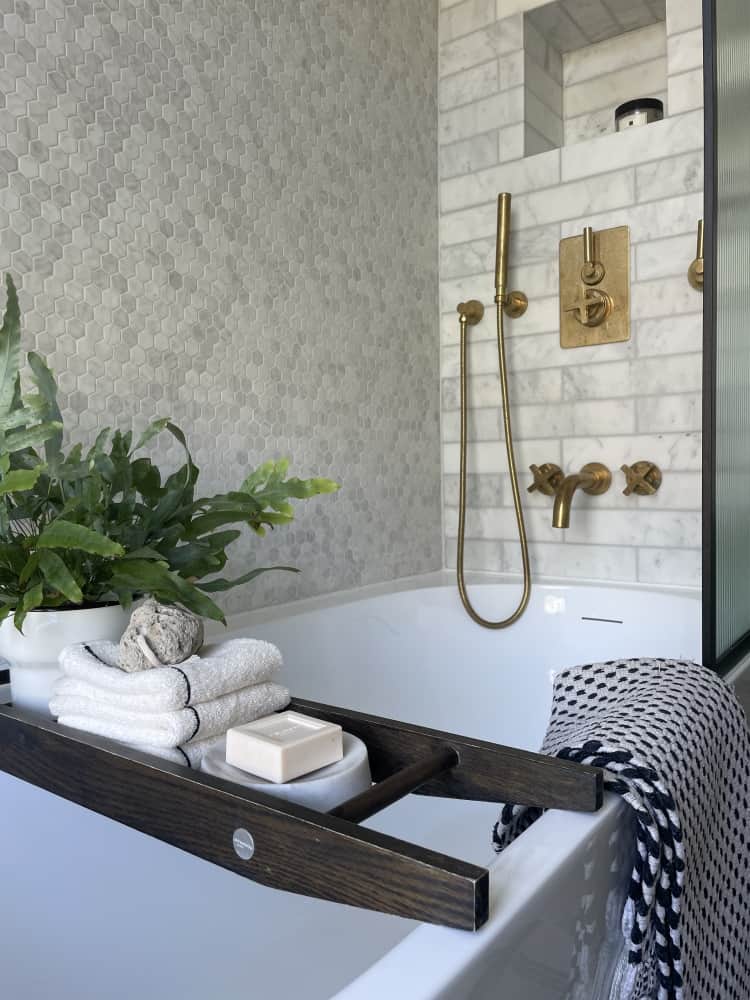 Inside look of the bathroom showcasing the bathtub and other accessories by Jikka - Bathroom Bromley